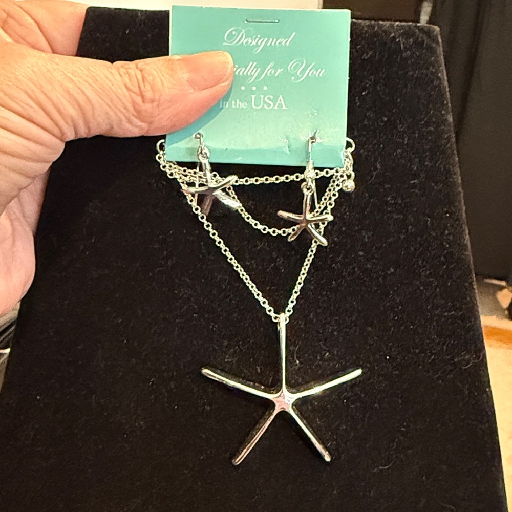 Matching Star necklace and earrings. NWT. Still in gift bag